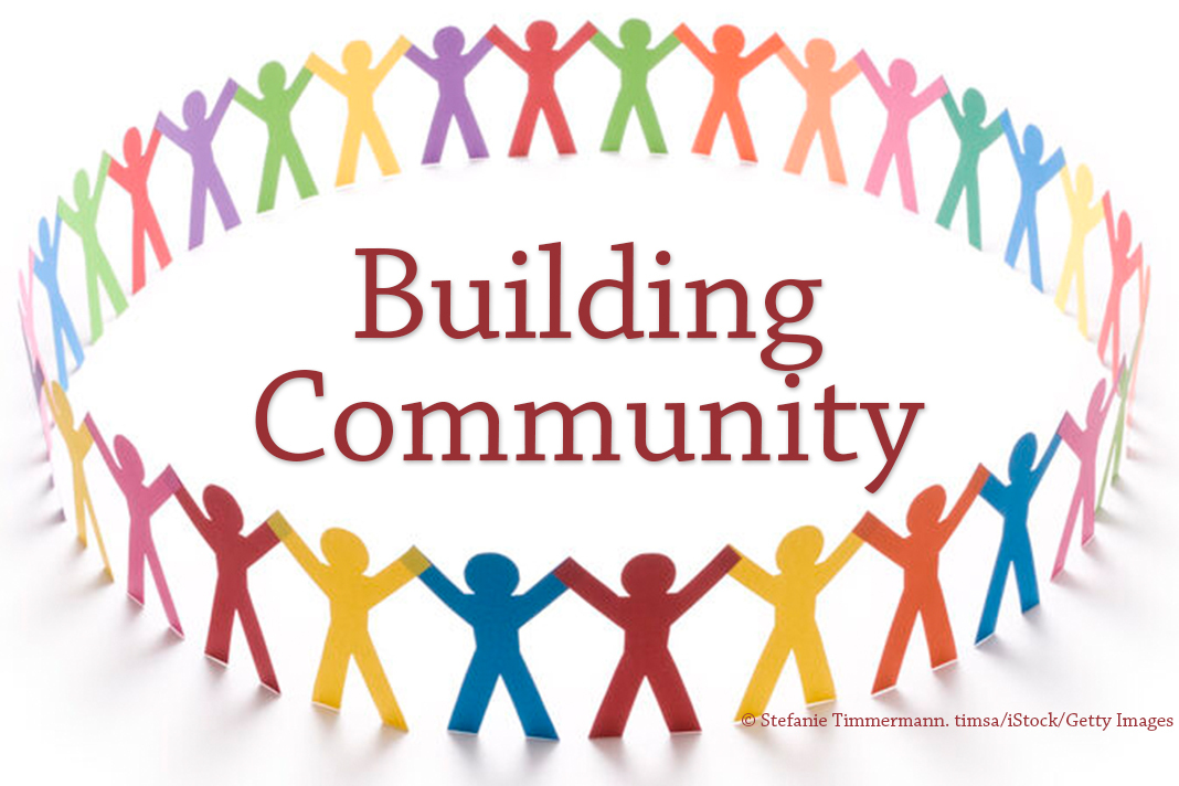 building community - text in center of circle of colorful paper dolls - timsa/iStock/Getty Images