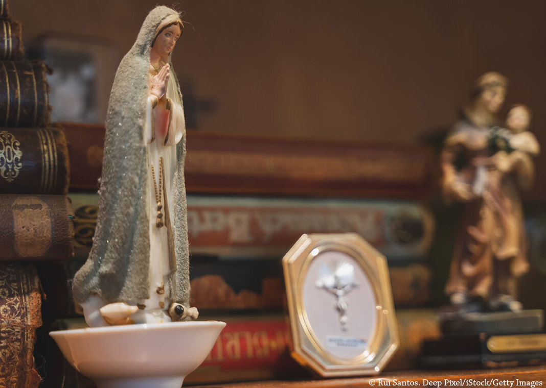 religious statues and books - © Rui Santos. Deep Pixel/iStock/Getty Images