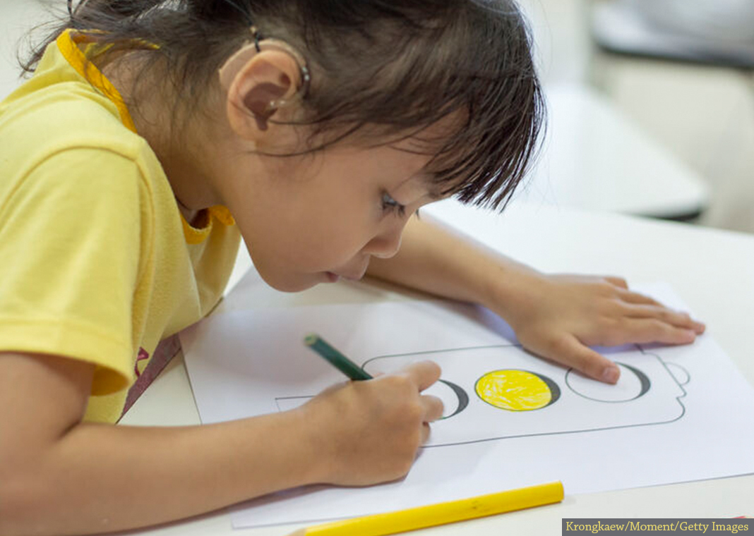 young girl coloring - Krongkaew/Moment/Getty Images